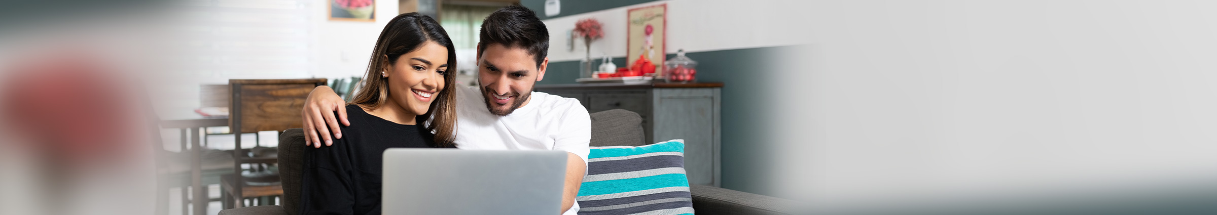 Hispanic couple on laptop