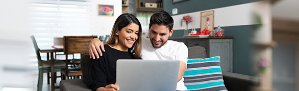 Hispanic couple on laptop