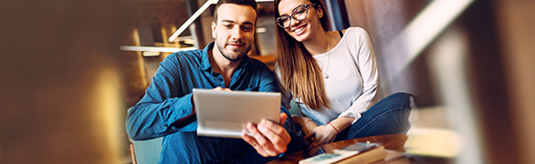 Young couple looking at laptop