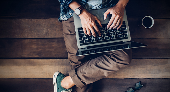 Man typing on computer