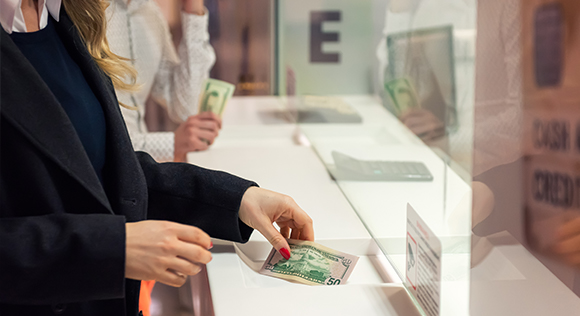 Woman paying with cash