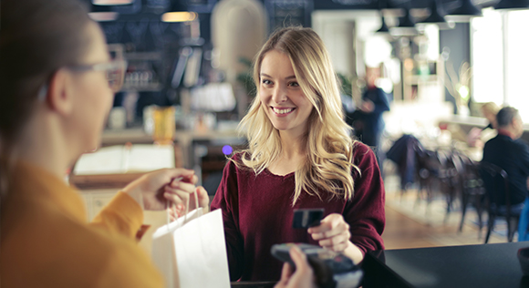 Woman making a purchase with a credit card