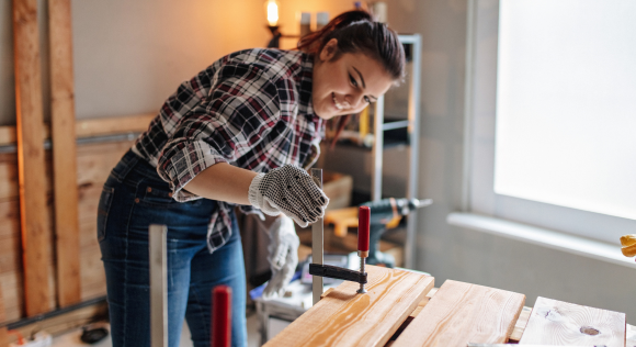 Woman working on her house